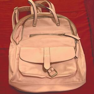 Beautiful, light pink backpack. Excellent condition. Lots of pockets.